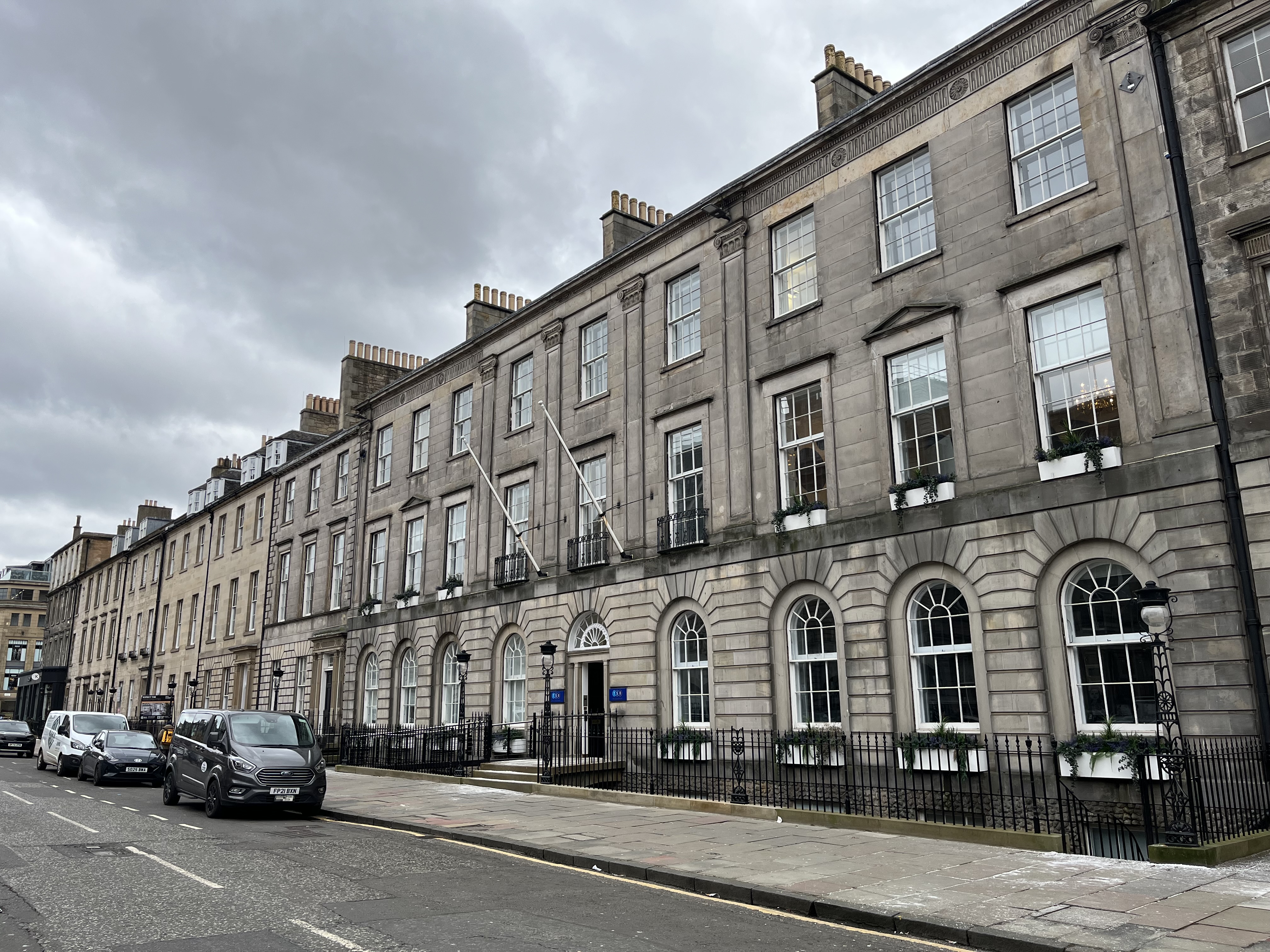 Exterior view of Henry Duncan House, a B‑listed Georgian office building on George Street, Edinburgh, with stone façades, sash windows and the street in the foreground.