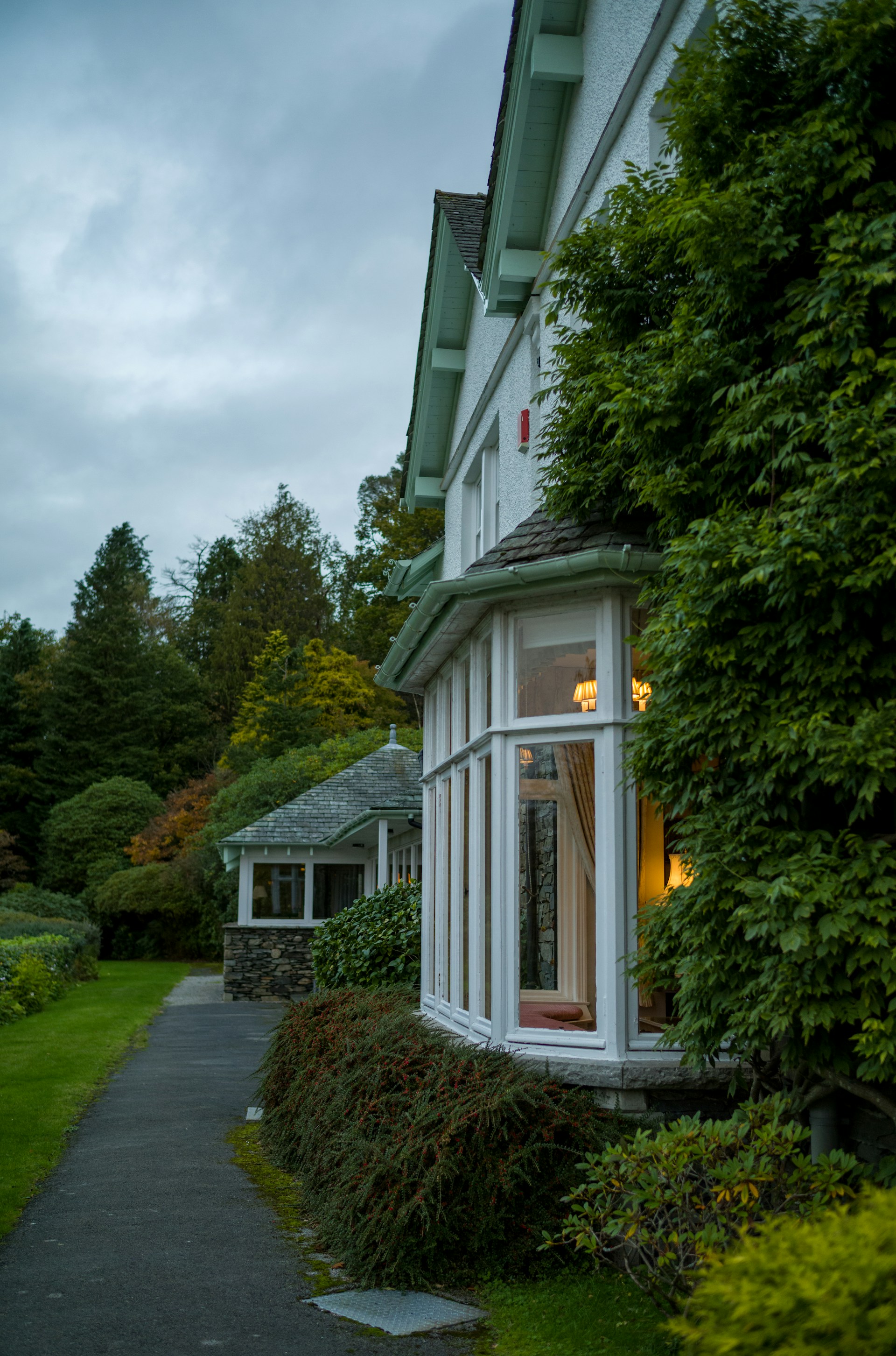 Residential family home surrounded by gardens, representing property matters following separation or divorce.
