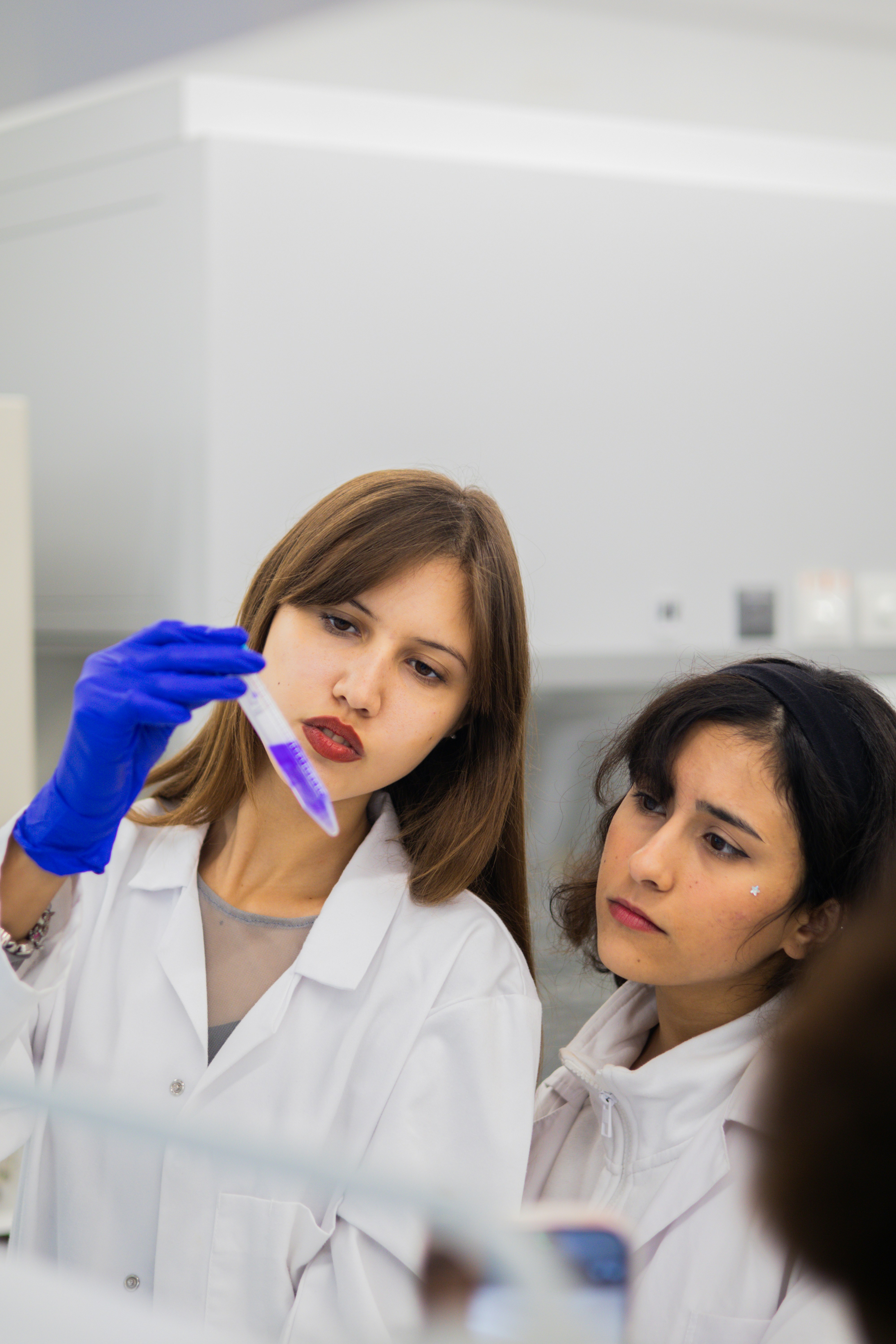 Life sciences researchers analysing a sample in a laboratory setting.