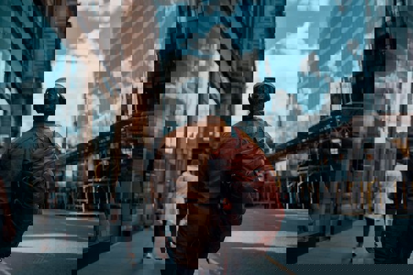 Person Walking With Backpack