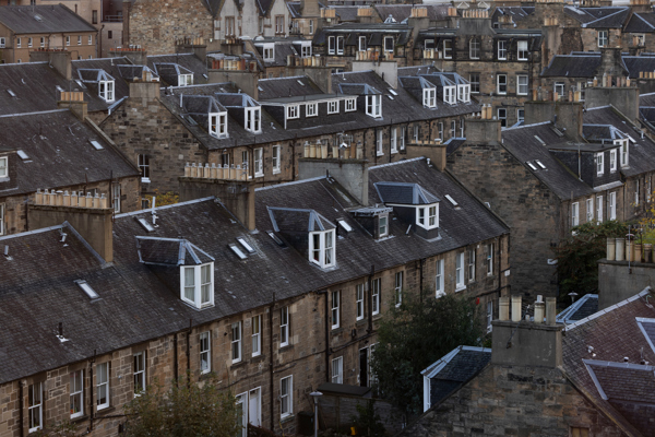 Rows of traditional Edinburgh tenement buildings in Scotland.