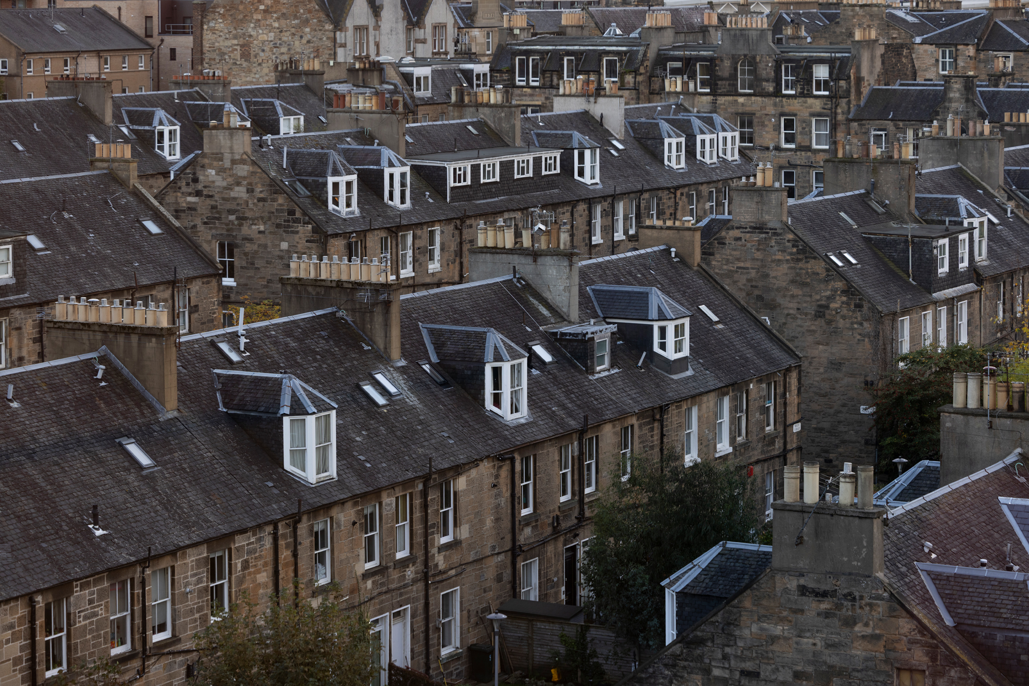 Rows of traditional Edinburgh tenement buildings in Scotland.